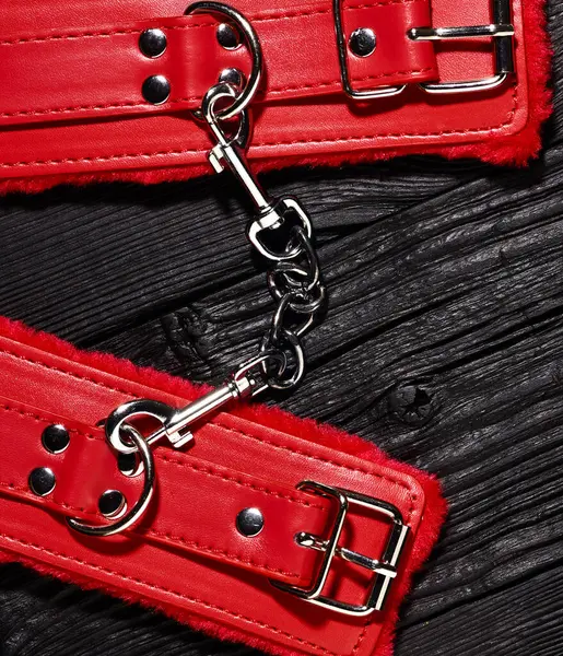 Red Handcuffs Black Wooden Backdrop Bdsm Background — Stock Photo, Image