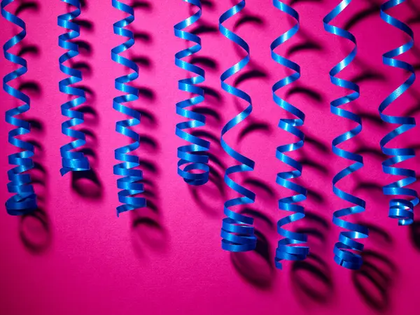 Decorative Blue Streamer Ribbons Pink Background — Stock Photo, Image