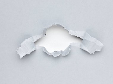 Kağıt üzerinde bir delik. yırtılmış iş kağıdı yüzey arkaplanı
