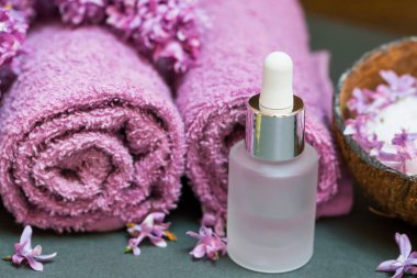 Lilac pure oil, lilac flowers essential oil bottle with pipette, aromatherapy and spa setting