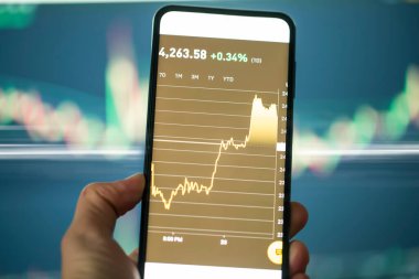 Market exchange and crypto trading, digital graphic of phone with rising markets finances