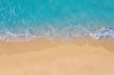 Top view of seashore with clear turquoise water