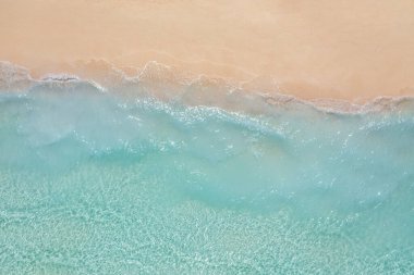 Top view of seashore with clear turquoise water