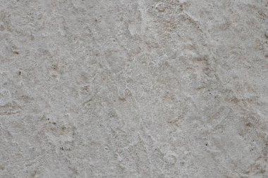 Kirli beton alçı dokusu. Dikkatsizce düzleştirilmiş beton bir duvarın ya da zeminin yüzeyinde beyazlama izleri, desen, arka plan, yüksek çözünürlük.