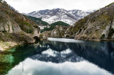 Appenines mountains peaks and the lake on Sagittarius Gorges, Abruzzo, Italy