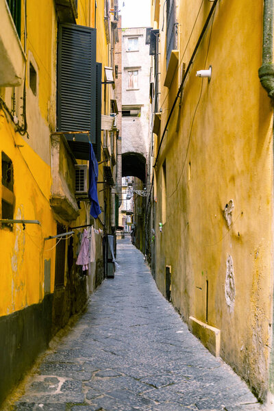 Narrow city street in the historical center of Naples, Italy
