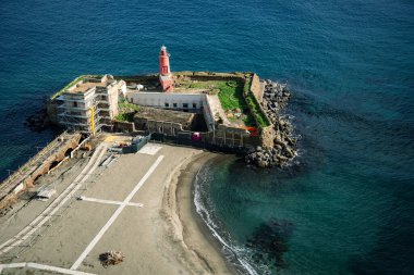 Baia, Naples, Campania, Italy. Lighthouse beach from the terrace of the Aragonese castle. clipart