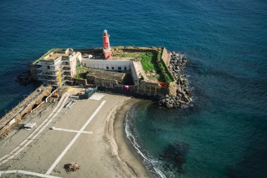 Baia, Naples, Campania, Italy. Lighthouse beach from the terrace of the Aragonese castle. clipart