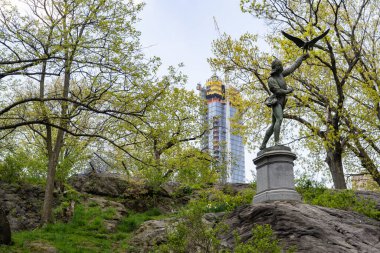 George Blackall Simonds iron cast sculpture called The Falconer 1871 is permanently situated on West 72nd Street inside Central Park. clipart