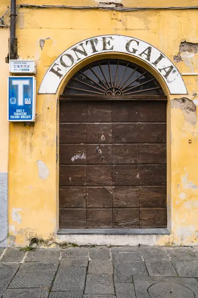 stock image Lucca, Italy - November 19, 2023: Italian Door of the Tobacco store. Old Italian street of a small town of Lucca in Tuscany. Italy