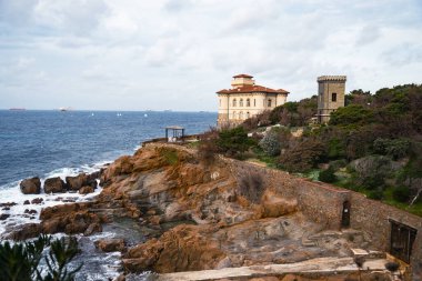 Boccale castle and the sandstone rocks of Romito during a winter season in Livorno, Tuscany region, Italy, Europe clipart