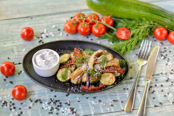 greek dish of zucchini with eggplant and sun-dried tomatoes