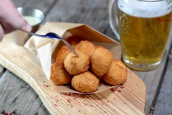 Deep fried Cheese balls with sauce and beer