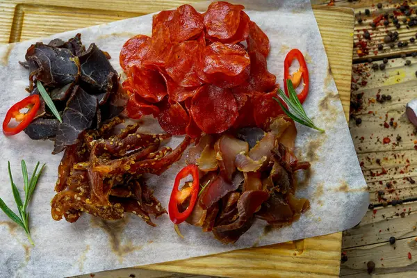 tasty salted meat  types of beer appetizer  and peppers