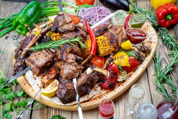 stock image tasty fried meat kebab  with vegetables and drinks