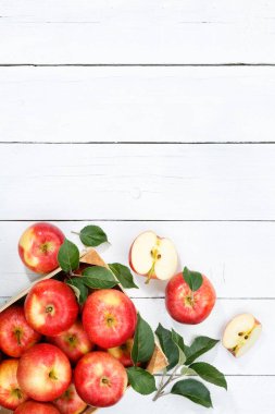 Apples apple fruits fruit with leaves from above portrait format copyspace copy space wooden board wood