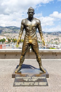 Cristiano Ronaldo statue in Funchal portrait format travel on Madeira island in Portugal clipart