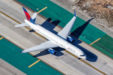 Los Angeles, United States - November 4, 2022 Delta Air Lines Boeing 757-200 airplane at Los Angeles airport (LAX) in the United States aerial view. clipart