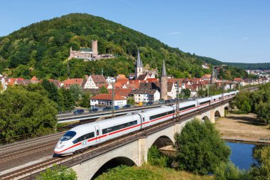 Gemuenden am Main, Germany - August 3, 2022 ICE 3 of Deutsche Bahn DB high-speed train railway in Gemuenden am Main, Germany. clipart