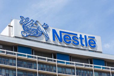 Frankfurt, Germany - August 2, 2022 German headquarters of Nestle corporation with logo in Frankfurt, Germany. clipart