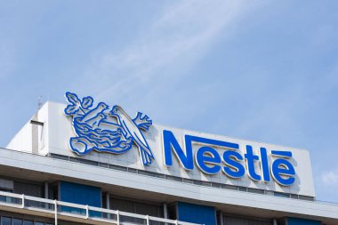 Frankfurt, Germany - August 2, 2022 German headquarters of Nestle corporation with logo in Frankfurt, Germany. clipart