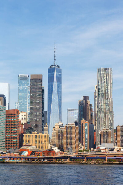New York City skyline of Manhattan with World Trade Center skyscraper portrait format traveling in the United States