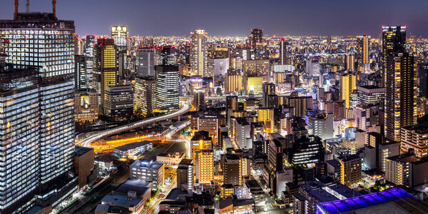 Osaka big city lights from above skyline with skyscraper panorama town at twilight in Japan