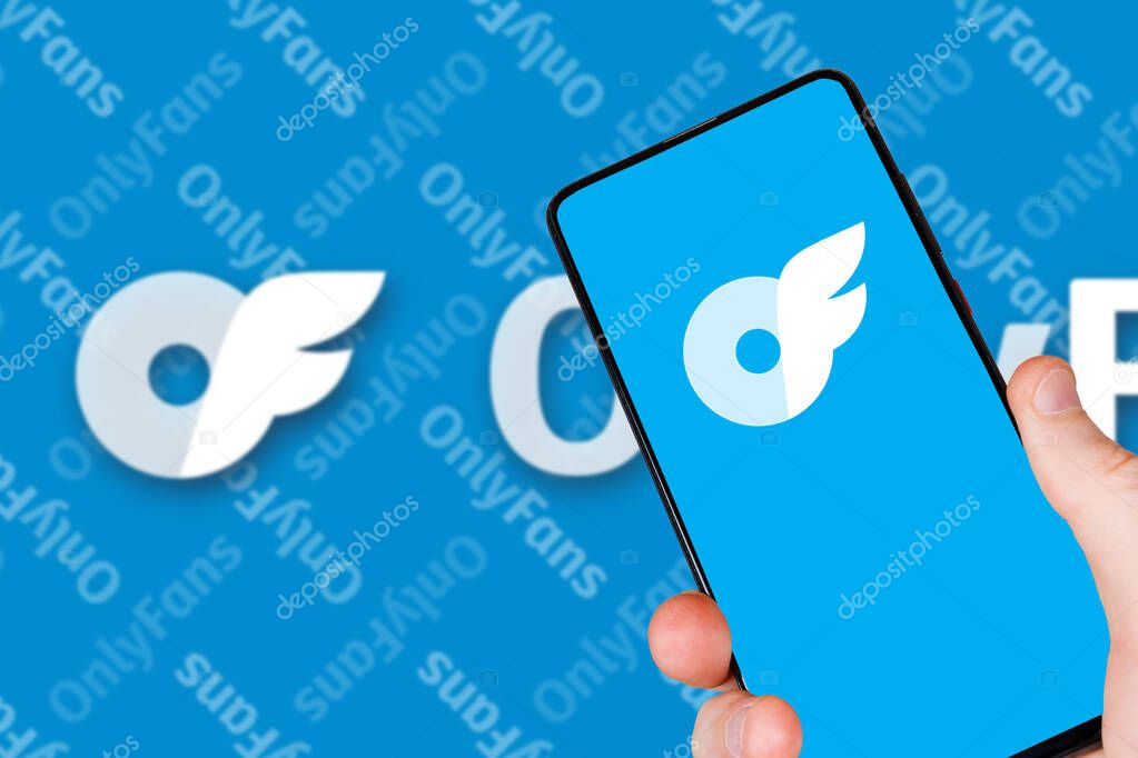 Stuttgart, Germany - May 1, 2024: OnlyFans app logo social media on smartphone and computer in Stuttgart, Germany.
