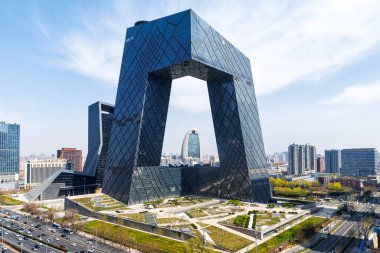 Beijing central business district CBD skyline with China Central Television CCTV headquarters HQ in Beijing, China clipart