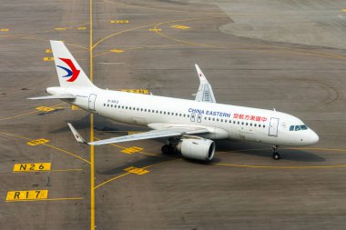 Hong Kong, China - April 7, 2024: China Eastern Airbus A320neo airplane at Hong Kong Chek Lap Kok Airport in China. clipart