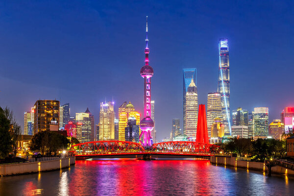 Shanghai skyline at Bund with Oriental Pearl Tower downtown at twilight night in China
