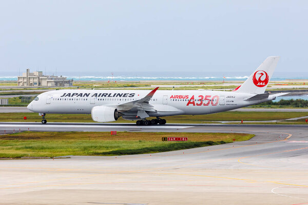 Naha, Japan - October 3, 2023: JAL Japan Airlines Airbus A350-900 airplane at Okinawa Naha Airport (OKA) in Japan.