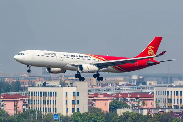 stock image Shanghai, China - April 10, 2024: Shenzhen Airlines Airbus A330-300 airplane at Shanghai Hongqiao Airport (SHA) in China.