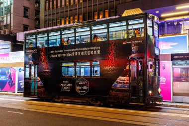 Hong Kong, China - April 6, 2024: Hong Kong Tramway double-decker tram public transport at Pedder Street Station in Hong Kong, China. clipart