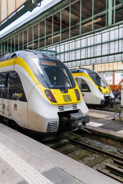 Stuttgart, Germany - May 25, 2024: Bombardier Talent regional trains operated by DB Regio and SWEG at the main railway station in Stuttgart, Germany. clipart