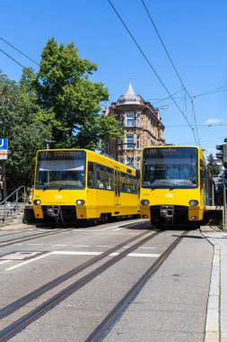 Stuttgart, Germany - July 8, 2024: Stadtbahn Stuttgart light rail vehicles type DT 8 public transport on line U15 at Eugensplatz stop in Stuttgart, Germany. clipart