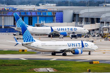 Tampa, United States - October 16, 2024: United Airlines Boeing 737 airplanes at Tampa Airport in the United States. clipart