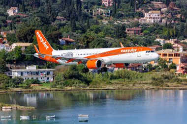 Corfu, Greece - June 7, 2024: EasyJet Airbus A321neo airplane at Corfu Airport in Greece. clipart