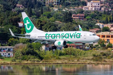 Corfu, Greece - June 7, 2024: Transavia Boeing 737-700 airplane at Corfu Airport in Greece. clipart