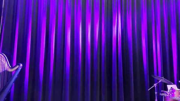 purple stage curtain in the theater