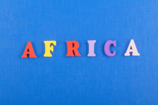 África Palavra Sobre Fundo Azul Composto Por Colorido Abc Alfabeto — Fotografia de Stock