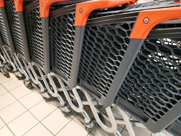 stock image row of empty shopping carts in the big supermarket