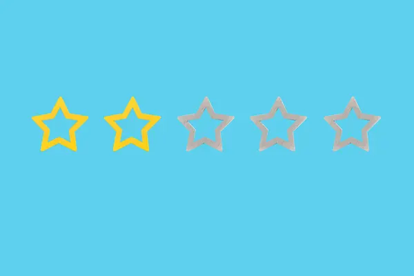 Gold, gray, silver five star shape on a blue background. The best excellent business services rating customer experience concept. Concept image of setting a five star goal.