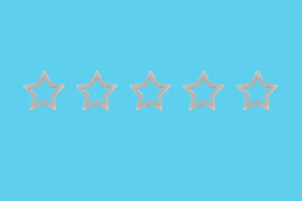 Gray, silver five star shape on a blue background. The best excellent business services rating customer experience concept. Concept image of setting a five star goal.