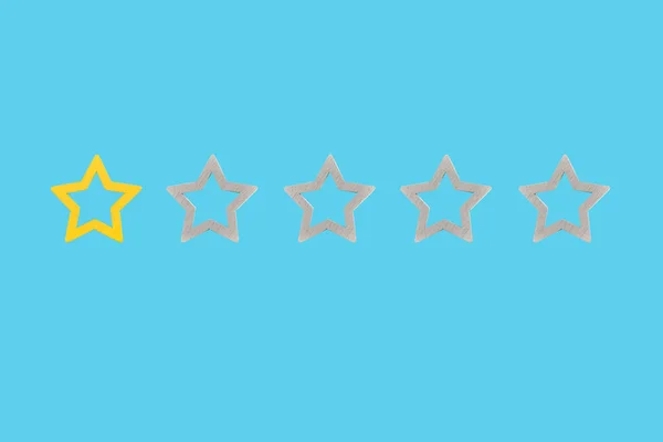 Gold, gray, silver five star shape on a blue background. The best excellent business services rating customer experience concept. Concept image of setting a five star goal.