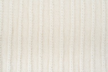 Süveter ya da atkı kumaş dokusu büyük örgü. Örülmüş forma ve kabartma desenli. Yün el yapımı makine, el yapımı.