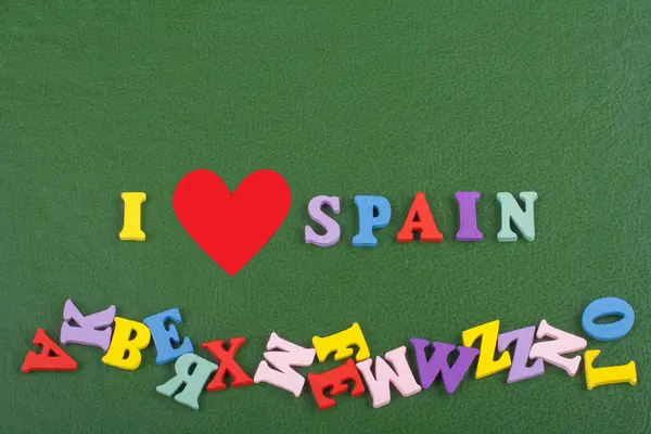 I love SPANISH word on green background composed from colorful abc alphabet block wooden letters, copy space for ad text. Learning english concept