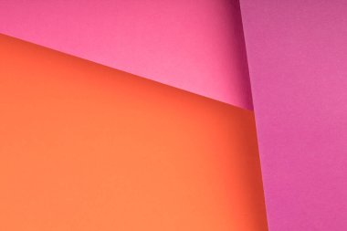 Yumuşak pembe ve yeşil kağıt arkaplanlı. Uzayı metin için kopyala. Üst görünüm