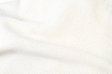 Süveter ya da atkı renginde büyük bir örgü. Örgü arka plan. Yünlü el yapımı araba.