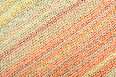 Süveter ya da atkı kumaş dokusu büyük örgü. Örülmüş forma ve kabartma desenli. Yün el yapımı makine, el yapımı.